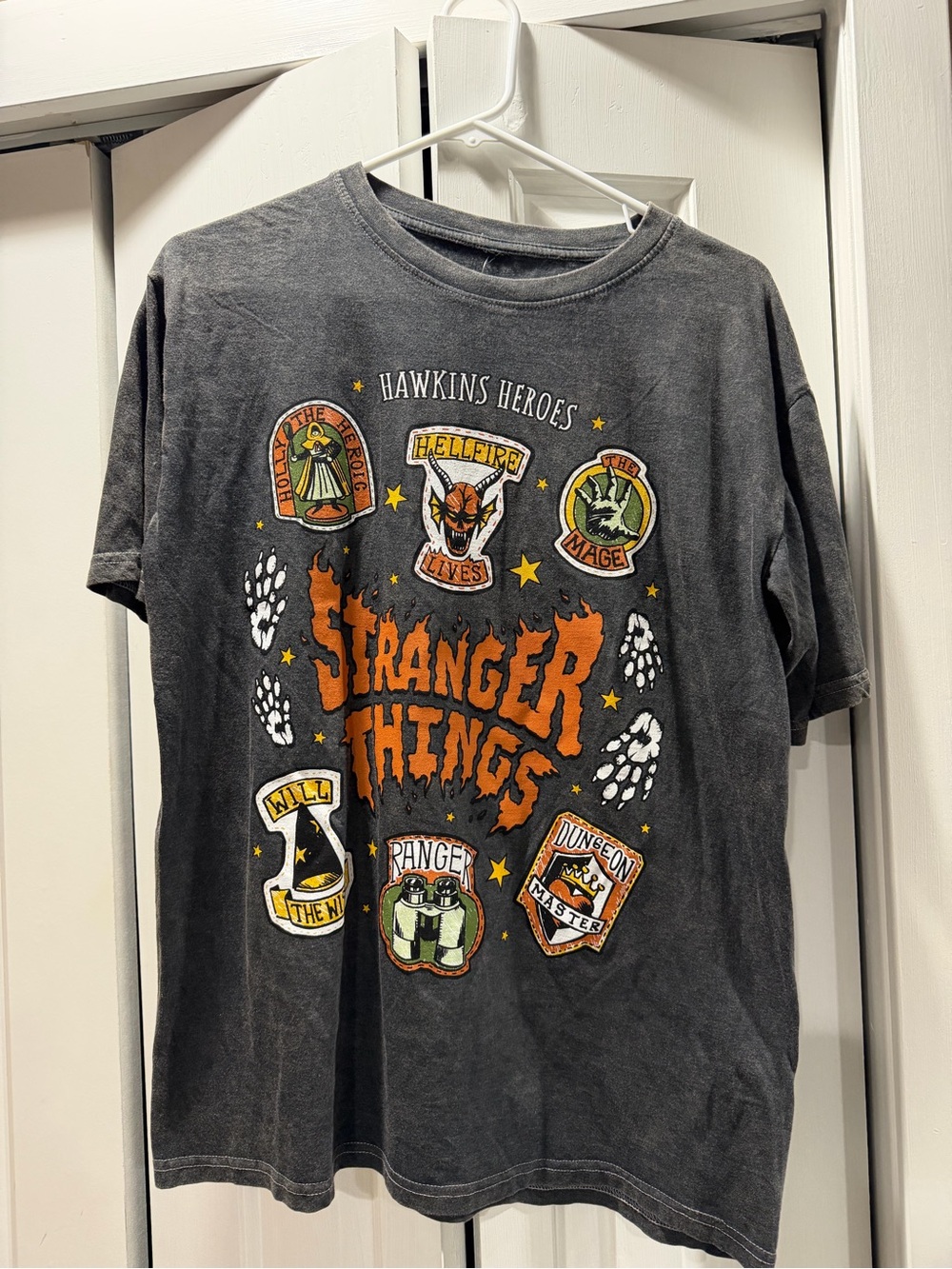 Hot Topic Black Stranger Things 'Hawkins Heroes' Graphic Tee with Orange Logo